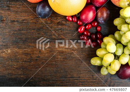 summer fruits on wooden background 47669807