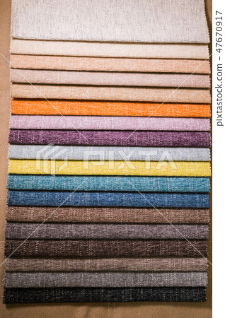 Colorful and bright fabric samples of furniture and clothing upholstery. Close-up of a palette of Colorful and bright fabric samples of furniture and clothing upholstery. Close-up of a palette of 47670917