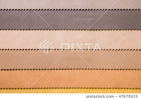 Colorful and bright fabric samples of leatherette furniture and clothing upholstery. Close-up of a Colorful and bright fabric samples of leatherette furniture and clothing upholstery. Close-up of a 47670919
