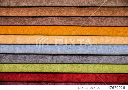 Colorful and bright fabric samples of furniture and clothing upholstery. Close-up of a palette of Colorful and bright fabric samples of furniture and clothing upholstery. Close-up of a palette of 47670926