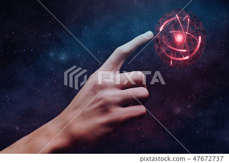 Human forefinger touches atom. Mixed media. Human forefinger touches atom. Mixed media. 47672737