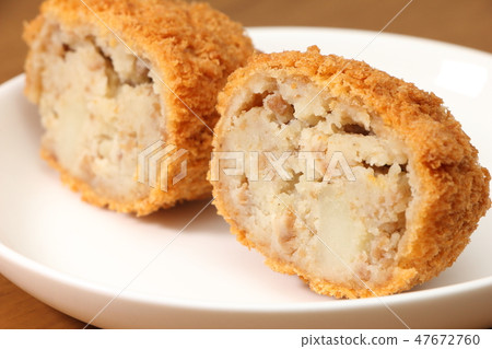 Cross section of beef croquette. Cross section of beef croquette. 47672760