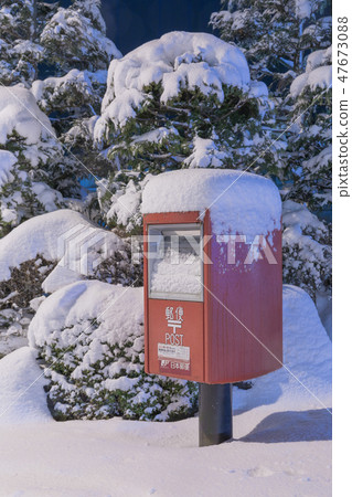 Mail post buried in snow 47673088