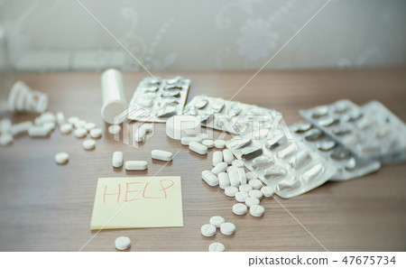 Men's hands close-up write on the sticker - help - slip and fall to the floor. concept of suicide Men's hands close-up write on the sticker - help - slip and fall to the floor. concept of suicide 47675734