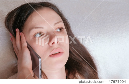 Young beautiful woman is speaking mobile phone. Young beautiful woman is speaking mobile phone. 47675904