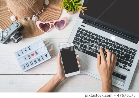 Young woman planning vacation trip 47676173