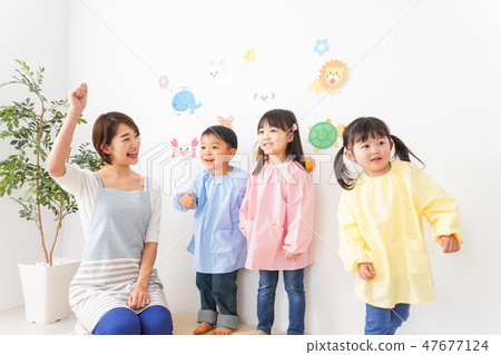 Kindergarten teachers and children 47677124