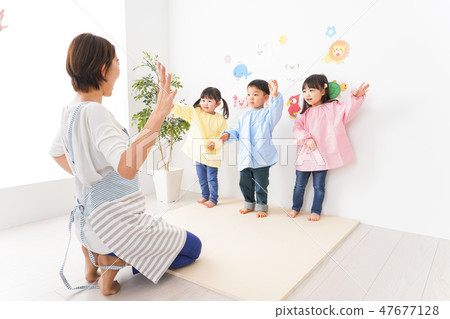 Kindergarten teachers and children Kindergarten teachers and children 47677128