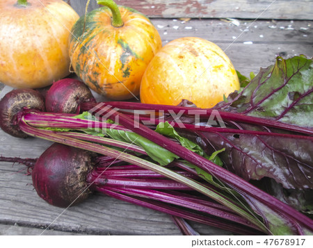 Vegetables on a wooden background. Vegetables on a wooden background. 47678917