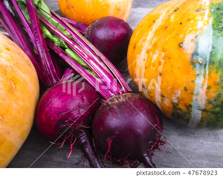 Vegetables on a wooden background. Vegetables on a wooden background. 47678923