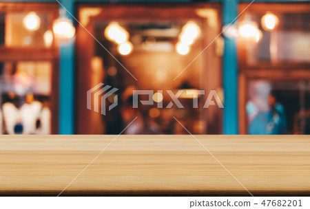 Selective Focus Empty wooden table in front of abstract blurred 47682201