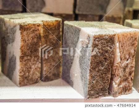 Bars of soap on a shop window. Cinnamon soap with natural cedar oil and herbal ingredients. Handmade 47684914