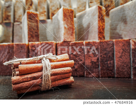 Bars of soap on a shop window. Cinnamon soap with natural cedar oil and herbal ingredients. Handmade 47684916