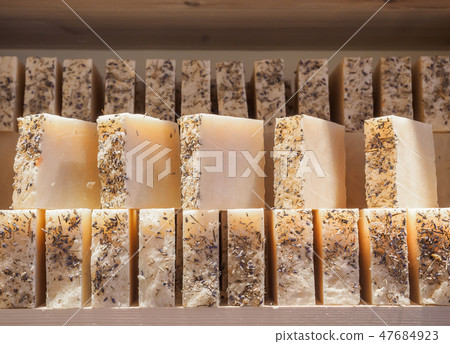Bars of soap on a shop window. Lavender soap with natural cedar oil, turpentine and herbal Bars of soap on a shop window. Lavender soap with natural cedar oil, turpentine and herbal 47684923