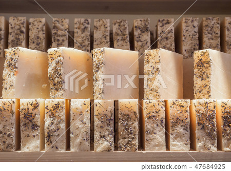 Bars of soap on a shop window. Lavender soap with natural cedar oil, turpentine and herbal Bars of soap on a shop window. Lavender soap with natural cedar oil, turpentine and herbal 47684925