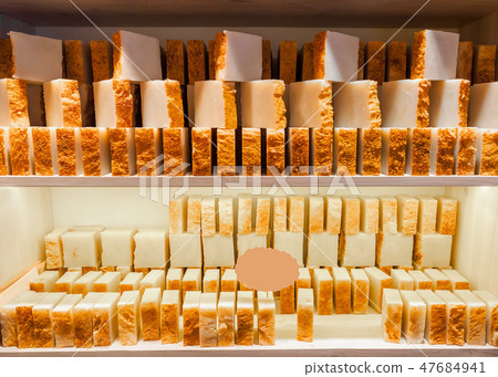 Bars of soap on a shop window. Turmeric soap with natural cedar oil and herbal ingredients. Handmade Bars of soap on a shop window. Turmeric soap with natural cedar oil and herbal ingredients. Handmade 47684941