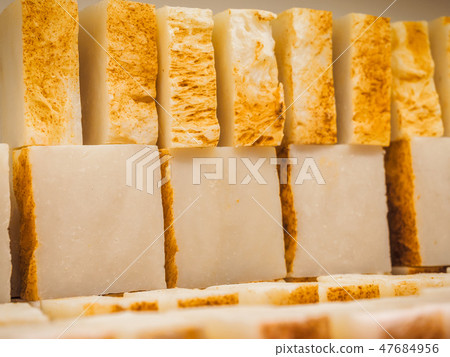 Bars of soap on a shop window. Turmeric soap with natural cedar oil and herbal ingredients. Handmade Bars of soap on a shop window. Turmeric soap with natural cedar oil and herbal ingredients. Handmade 47684956