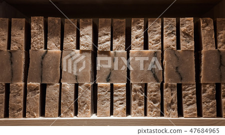 Bars of soap on a shop window. Coffee soap with natural cedar oil, turpentine and herbal ingredients Bars of soap on a shop window. Coffee soap with natural cedar oil, turpentine and herbal ingredients 47684965