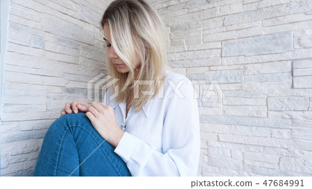 Sad or Depressed Young Beautiful Woman 47684991