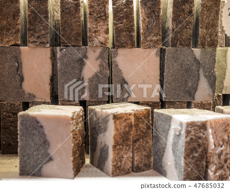 Bars of soap on a shop window. Tar soap with natural cedar oil, turpentine and herbal ingredients Bars of soap on a shop window. Tar soap with natural cedar oil, turpentine and herbal ingredients 47685032