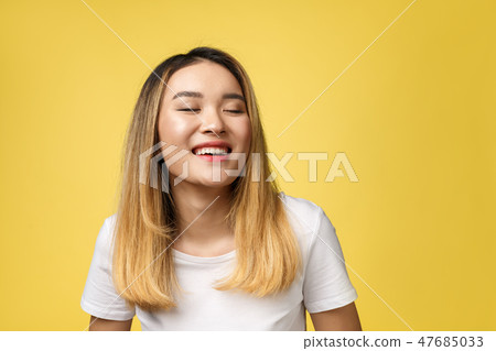 Close up of young Asian beautiful woman with smiley face Close up of young Asian beautiful woman with smiley face 47685033
