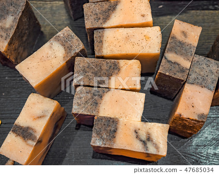 Bars of soap on a shop window. Tar soap with natural cedar oil, turpentine and herbal ingredients Bars of soap on a shop window. Tar soap with natural cedar oil, turpentine and herbal ingredients 47685034