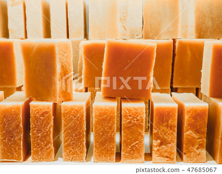 Bars of soap on a shop window. Orange soap with natural cedar oil and herbal ingredients. Handmade Bars of soap on a shop window. Orange soap with natural cedar oil and herbal ingredients. Handmade 47685067