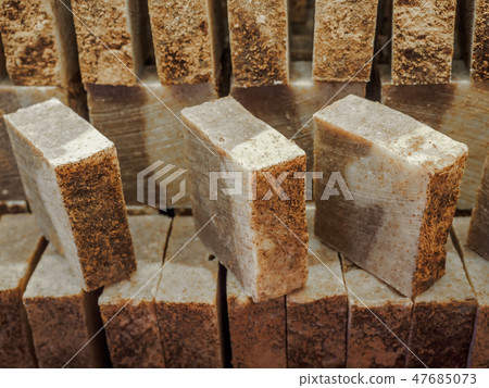 Bars of soap on a shop window. Cinnamon soap with natural cedar oil and herbal ingredients. Handmade Bars of soap on a shop window. Cinnamon soap with natural cedar oil and herbal ingredients. Handmade 47685073