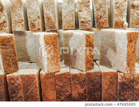 Bars of soap on a shop window. Cinnamon soap with natural cedar oil and herbal ingredients. Handmade Bars of soap on a shop window. Cinnamon soap with natural cedar oil and herbal ingredients. Handmade 47685085