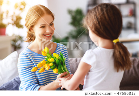 happy mother's day! child gives mother a bouquet happy mother's day! child gives mother a bouquet 47686812