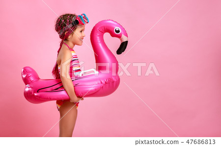 happy child girl in swimsuit with swimming ring fl happy child girl in swimsuit with swimming ring fl 47686813
