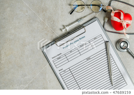 Patient progress note with stethoscope, red heart 47689159