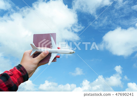 Tourist holding airplane flight travel traveler Tourist holding airplane flight travel traveler 47690241