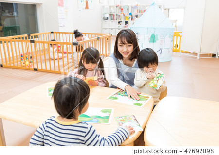 Nursery school, nursery teacher, infant, playing 47692098