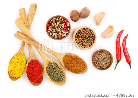 mix of spices in wooden spoon isolated on a white background. Top view. Flat lay. Set or collection mix of spices in wooden spoon isolated on a white background. Top view. Flat lay. Set or collection 47692162