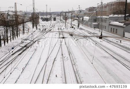 Train station with railways and trains in the winter. Top view. 47693139