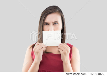 A woman in the red shirt holding the blank white card with space A woman in the red shirt holding the blank white card with space 47693822