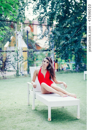 girl in red swimsuit 47696010