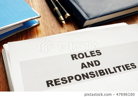Roles and Responsibilities documents on a desk. Roles and Responsibilities documents on a desk. 47696180