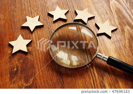Evaluationconcept. Five stars and magnifying glass Evaluationconcept. Five stars and magnifying glass 47696183
