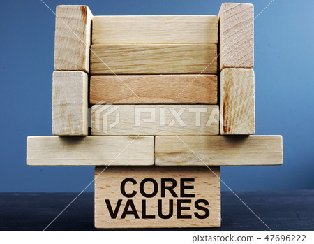 Tower of wooden blocks with sign core values. 47696222