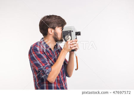 Vintage and people concept - man look through the retro camera over the white background 47697572