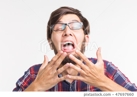 People, feelings and gesture concept - scared man hiding behind his hands from something unseen on People, feelings and gesture concept - scared man hiding behind his hands from something unseen on 47697660