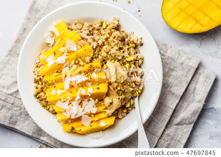 Oatmeal with mango, coconut, peanut butter  47697845