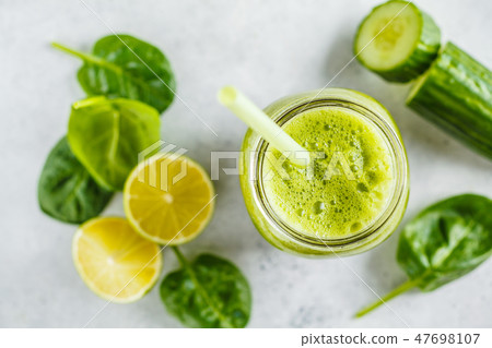 Green healthy smoothie in the jar, top view 47698107