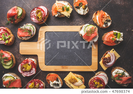 Assorted spanish tapas with fish, sausage, cheese 47698374
