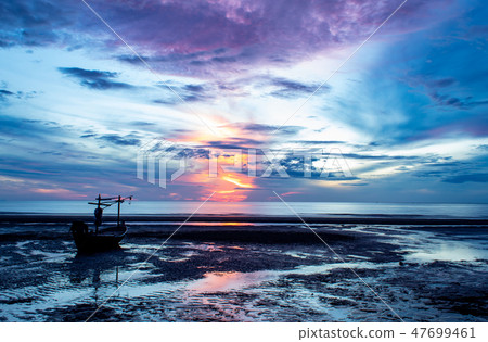 The morning sun light in the sea and the boat. 47699461