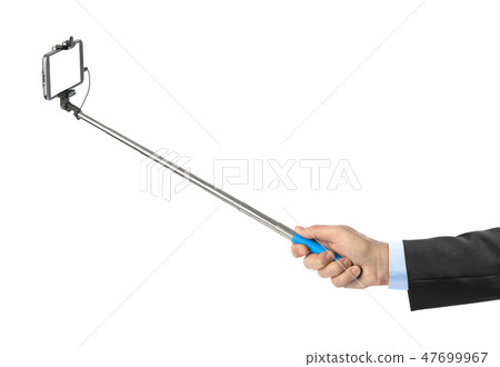 Hand and smartphone with selfie stick 47699967