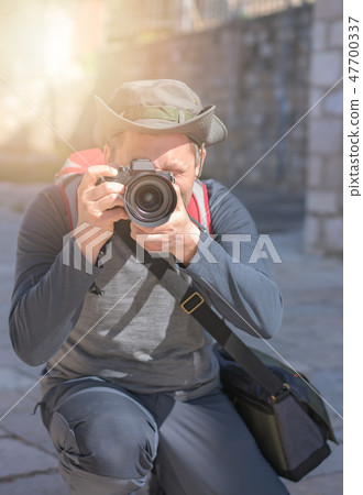 Portrait of a professional photographer 47700337