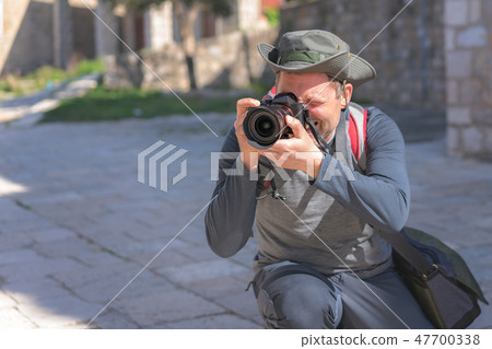 Portrait of a professional  photographer 47700338